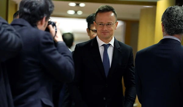 Hungary's Foreign Minister Peter Szijjarto, center, arrives for a meeting of EU foreign ministers at the European Council building in Brussels on Monday, Jan. 23, 2023 (AP).