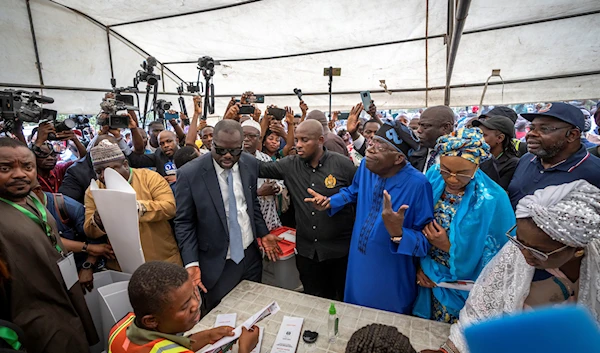 Nigerians vote in tight race to choose successor to President Buhari