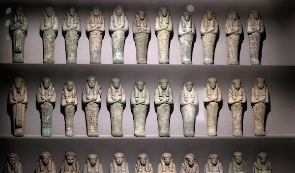 Series of bronze funerary statues of king Psusennes I, are displayed at the Egyptian museum in Cairo, Egypt, Monday, Feb. 20, 2023 (AP Photo/Amr Nabil)