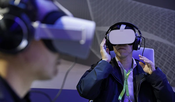 People use Oculus VR headsets at the Panasonic booth at CES International, Tuesday, Jan. 8, 2019, in Las Vegas. (AP)