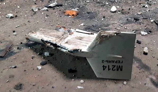 Undated photograph released by the Ukrainian military's Strategic Communications Directorate shows the wreckage of what Kyiv has described as an Iranian Shahed drone downed near Kupiansk (Ukrainian military's Strategic Communications Directorate via AP)