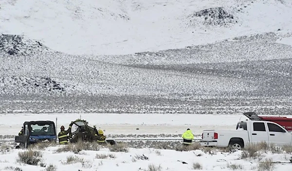 A Care Flight medical transport plane carrying a patient and four others that crashed the day before is seen Saturday, Feb. 25, 2023, in Lyon County, Nev. (Jason Bean/The Reno Gazette-Journal via AP)