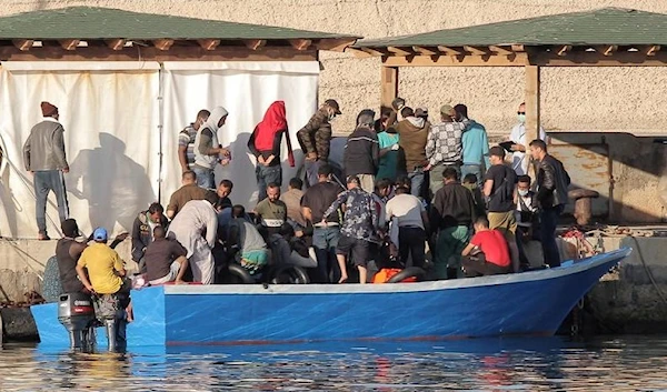 Migrants disembark a boat on the Sicilian Island of Lampedusa, Italy July 24, 2020. (Reuters)