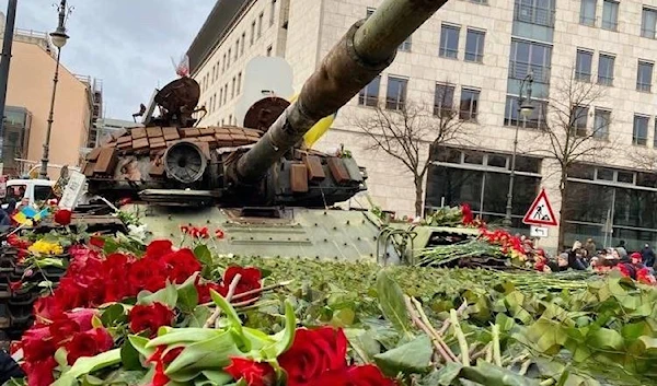 The wreck of a Russian T-72 tank is placed in front of the Russian Embassy by Ukrainian and German activists in collaboration with the Ukrainian MoD in Berlin, Germany, Friday, Feb. 25, 2023 (social media)