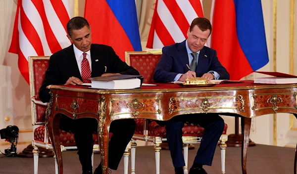 President Barack Obama, left, and Russian President Dmitry Medvedev sign the New START treaty at the Prague Castle in Prague on April 8, 2010 (AP Photo/Alex Brandon, File)