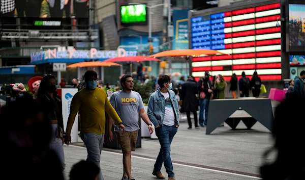 People make their way through Times Square, in Manhattan, New York City, United States, May 7, 2021 (Reuters)