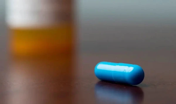 A psilocybin capsule displayed. (Associated Press)