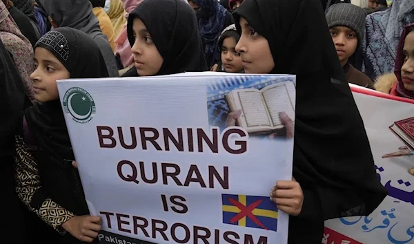 Youngs girls take part in a rally called by 'Muslim Women League' group take part in a rally to denounce the recent desecration of Islam's holy book by far-right activists in Sweden and the Netherlands, in Lahore, Pakistan, Sunday, Jan. 29, 2023. (AP)