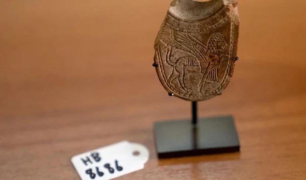 A 2,700-year-old ivory incense spoon plundered from a site in the occupied West Bank.(AP)