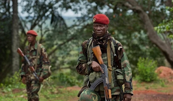 Troops from the Central African Republic stand guard at a building, in Obo, Central African Republic. (Reuters)