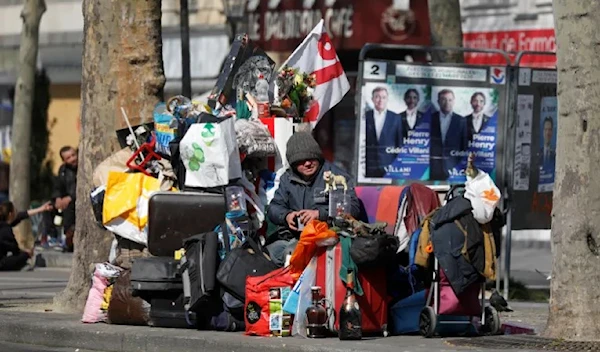 A homeless man on the street in Paris in 2020 (Reuters)