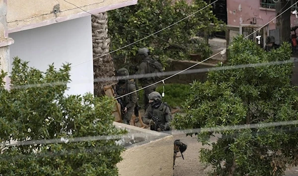 The IOF raiding Aqabat Jaber camp on Saturday, Feb. 4, 2023 (AP)