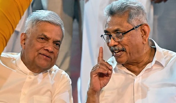 Sri Lanka's President Ranil Wickremesinghe (L) along with the country's former President Gotabaya Rajapaksa attend the annual Buddhist Navam procession at the Gangaramaya Temple in Colombo on February 5, 2023. (AFP)