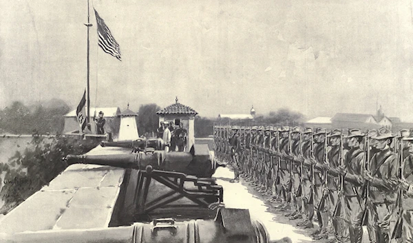 Raising the American flag over Fort Santiago, Manila, on the evening of August 13, 1898 (Harper's Pictorial History of the War with Spain).