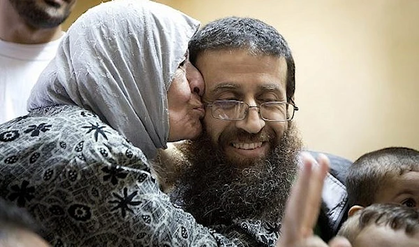 Palestinian Khader Adnan is greeted after his release from an Israeli prison in the West Bank. July 12, 2015. (AP)