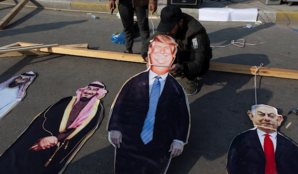 Activists prepare cardboard cutouts from right, Israeli Prime Minister Benjamin Netanyahu, US President Donald Trump and Saudi Arabia's king Salman bin Abdulaziz, are hung to a gallows, during a rally in Baghdad, Iraq, Saturday, Dec. 14, 2019 (AP).