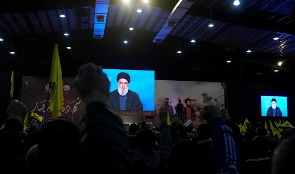 Hezbollah leader Sayyed Hassan Nasrallah speaks via a video link in the southern suburb of Beirut, Lebanon, February 16, 2023 (AP Photo)