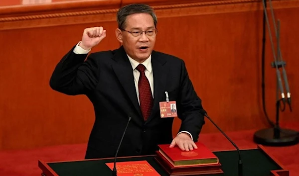 China's newly-elected Premier Li Qiang takes an oath after being elected during the fourth plenary session of the National People's Congress (NPC) at the Great Hall of the People in Beijing, China on March 11, 2023. (Reuters)