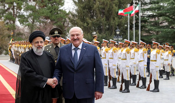 Iranian President Ebrahim Raisi shakes hands with Belarusian President Alexander Lukashenko in an official welcoming ceremony at the Saadabad Palace in Tehran, Iran, Monday, March 13, 2023 (Iranian Presidency).