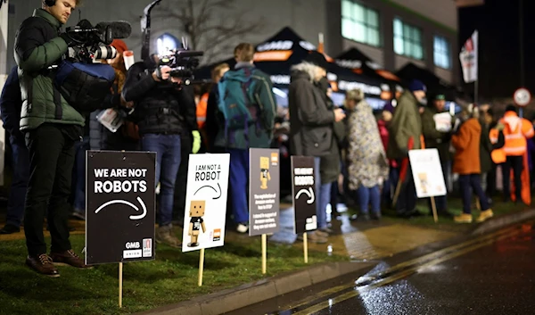 People gathered during a rally outside the Amazon depot in Coventry, UK, on January 25, 2023 (Reuters)