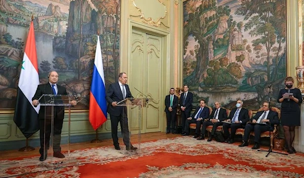 Russia's Foreign Minister Sergei Lavrov and Syria's Foreign Minister Faisal Mekdad attend a news conference following their talks in Moscow, Russia February 21, 2022 (Reuters).