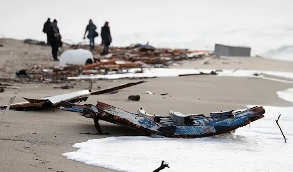 A view of the wreckage of a shipwreck in southern Italy which has left dozens of migrants dead after the boat in which they were travelling smashed onto the rocks, in Cutro, Italy, February 27, 2023. (Reuters)