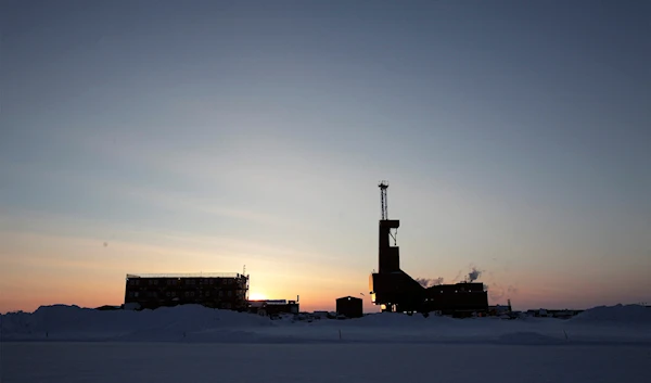 The sun sets behind an oil drilling rig in Prudhoe Bay, Alaska on March 17, 2011. (Reuters)