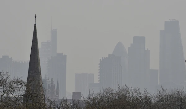 The City of London financial district is seen from Primrose Hill as high air pollution obscures the skyline over London April 10, 2015. (Reuters)