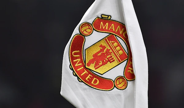 A corner flag showing the logo of Manchester United is seen ahead of the English FA Cup 4th round soccer match between Manchester United and Reading at Old Trafford in Manchester, England, Saturday, Jan. 28, 2023. (AP)