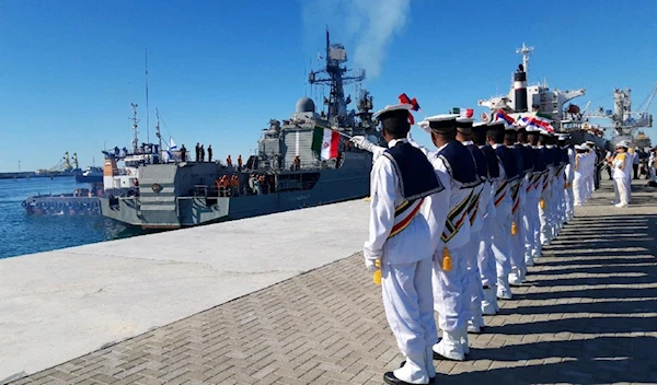 Iranian navy saluting the Russian Navy in December 2019 during Iran-Russia-China joint naval drills (AFP)