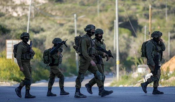 Israeli soldiers in village of Sarra near the Palestinian West Bank city of Nablus, Sunday, March 12, 2023 (AP /Majdi Mohammed)