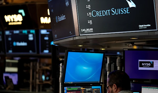 A sign displays the name of Credit Suisse on the floor at the New York Stock Exchange in New York, March 15, 2023 (AP)