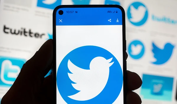 The Twitter logo is seen on a cell phone, Friday, Oct. 14, 2022, in Boston (AP Photo/Michael Dwyer)