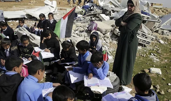 Palestinian children attend improvised class in the village of Abu Nuwar, occupied West Bank, after the Israeli occupation demolished their two-classroom school. (AP)