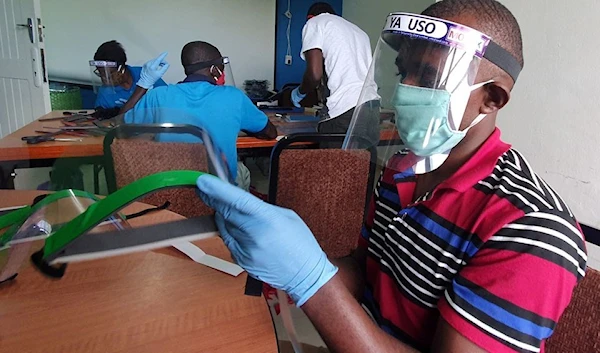 Workers prepare face shields from recycled plastics at the Zaidi Recyclers workshop as a measure to stop the spread of coronavirus disease (COVID-19) in Dar es Salaam, Tanzania May 27, 2020. (Reuters)