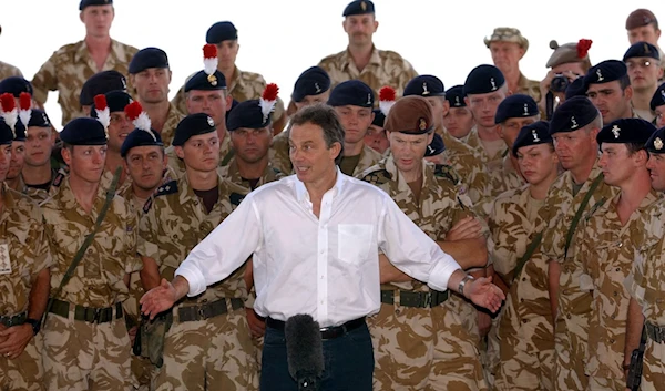 Former British Prime Minister Tony Blair addresses UK occupation troops in Basra, Iraq, on 29 May, 2003 (AFP)