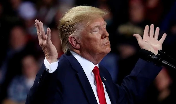 President Donald Trump reacts during a campaign rally in Battle Creek, Michigan. (REUTERS)