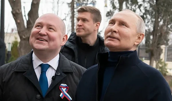 Russian President Vladimir Putin, right, visits the Children's Art and Aesthetic center in Sevastopol, Crimea, Saturday, March 18, 2023 [Sputnik, Kremlin Press Service Pool Photo via AP]