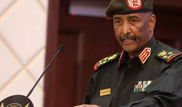 Colonel-General Abdel Fattah Al-Burhan, chairman of Sudan's ruling Transitional Sovereign Council speaks at a press conference (AFP)