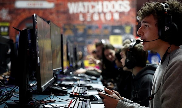 Attendees play “Roller Champions” by Ubisoft at the Paris Games Week in Paris, France, October 29, 2019. (Reuters)