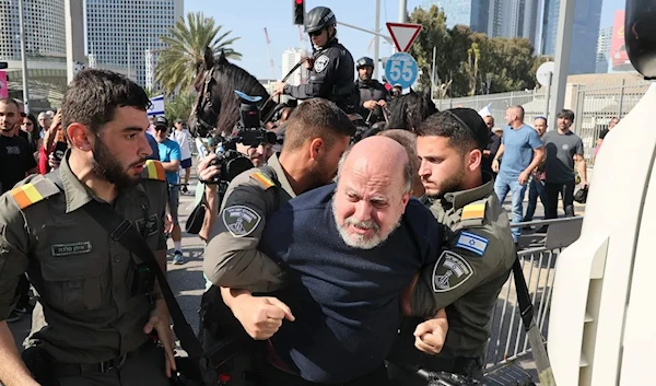 Israeli forces detain a protester during a demonstration in “Tel Aviv” on Wednesday against the government's overhaul bill. (Getty Images)