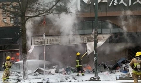 An image from the scene showing firefighters fighting the flames (Twitter)