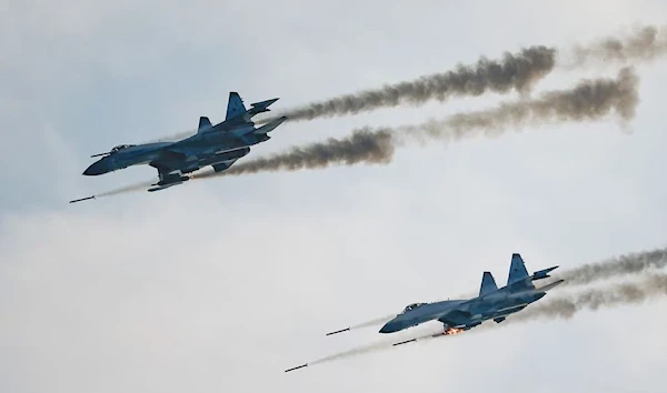 Russian Sukhoi Su-35 jet fighters fire missiles during the Aviadarts competition outside Ryazan, Russia August 27, 2021 (Reuters)