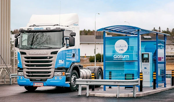 An image of a truck pertaining to the Gasum company in Finland near a gas pump in an undated photo (Gasum)