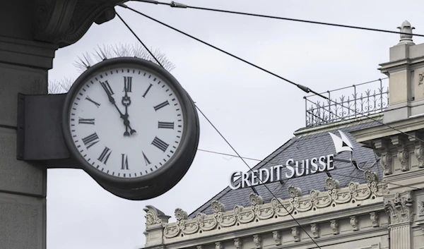 A clock is seen near the Swiss bank Credit Suisse in Zurich on March 20, 2023 (AP)