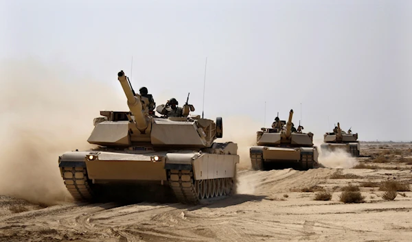 Iraqi Army M1A1 Abrams tanks, purchased from the US, maneuver during a live fire exercise outside Baghdad, Iraq, October 18, 2011 (AP)