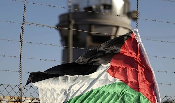 A Palestinian flag flutters next to an Israeli prison. (Archive)