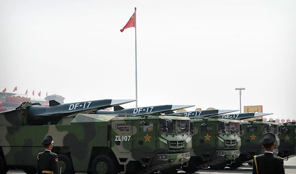 Chinese military vehicles carrying DF-17 ballistic missiles roll during a parade to commemorate the 70th anniversary of the founding of Communist China in Beijing, Tuesday, Oct. 1, 2019 (AP Photo/Mark Schiefelbein)