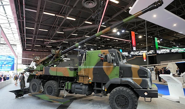 A French artillery piece Caesar is photographed at the Eurosatory arms show in Villepinte, north of Paris, Tuesday, June 14, 2022 (AP Photo/Michel Euler)