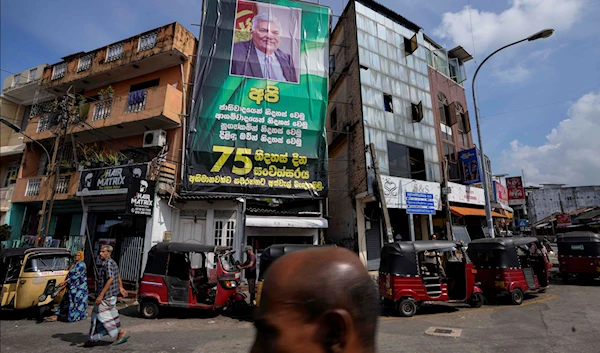 A huge poster with a photograph of President Ranil Wickremesinghe is displayed on the facade of a building in Colombo, Sri Lanka, March 22, 2023 (AP)